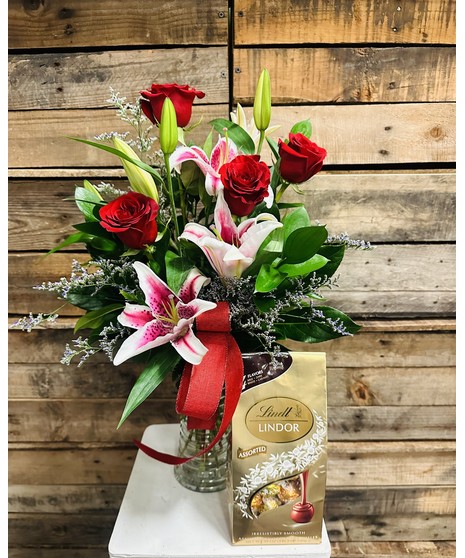 lilies and roses with chocolates